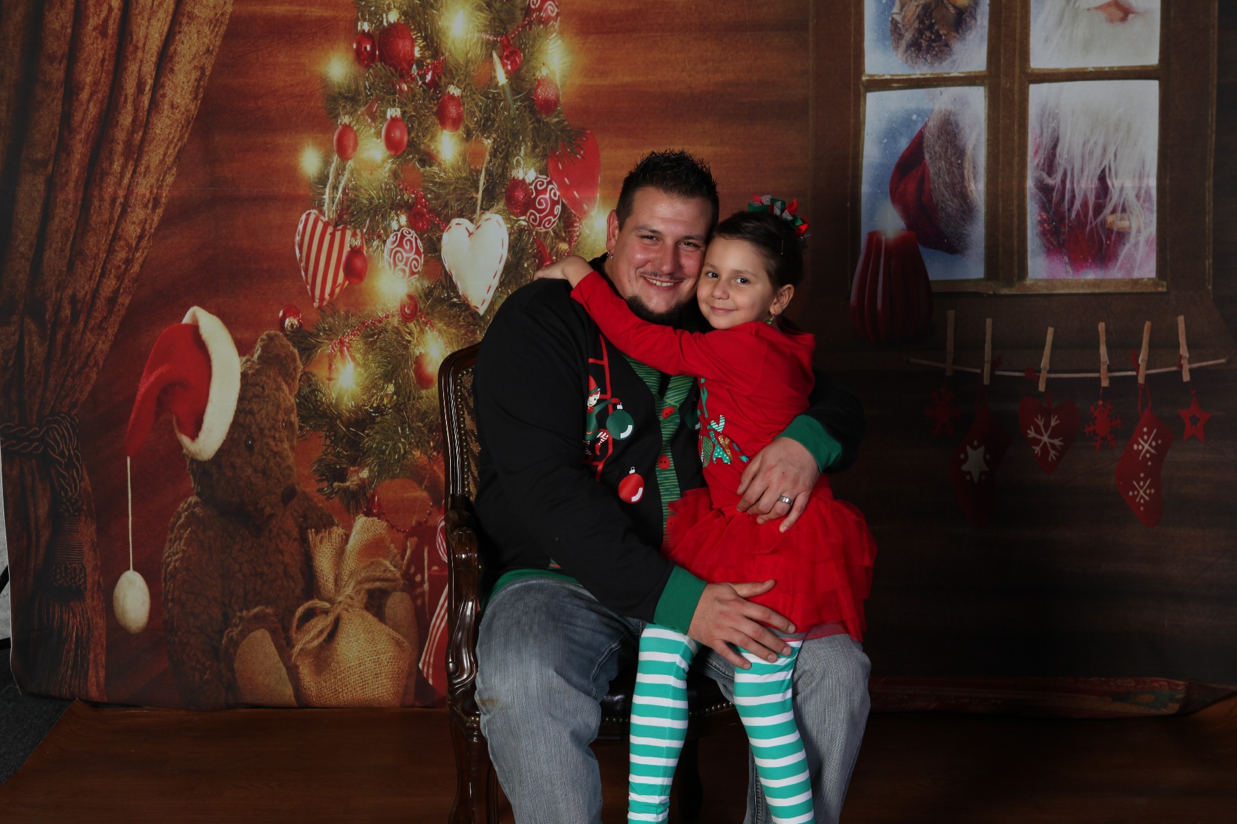 Father and daughter in a Christmas portrait